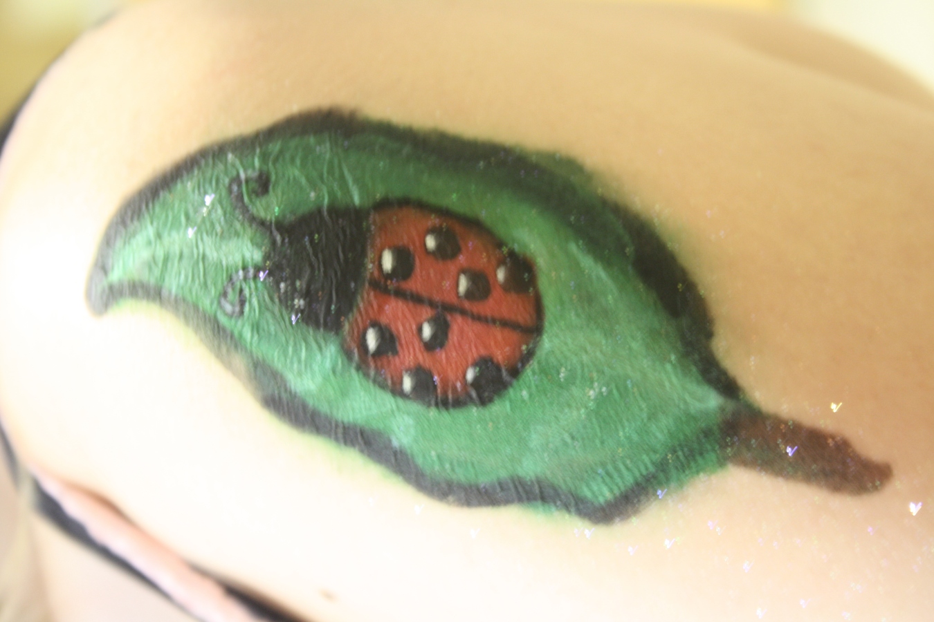 ladybug tattoo. ladybug tattoo close up